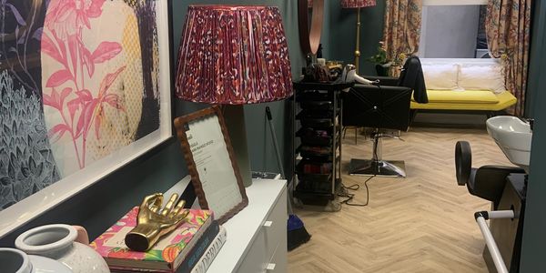 Stylish salon interior with decorative elements and seating.