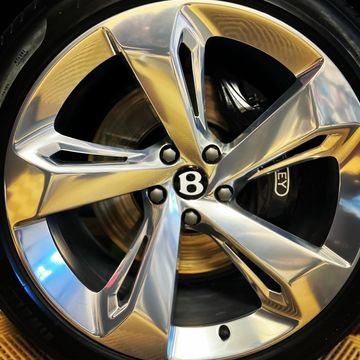 Bentley Benteyga rim and tire after our ND team completed a ceramic coating job on the vehicle 