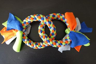 2 large handmade rings interlocked, in lime green, grey, orange and royal blue.