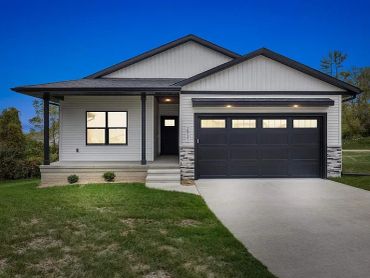 Modern single-story house with a two-car garage.