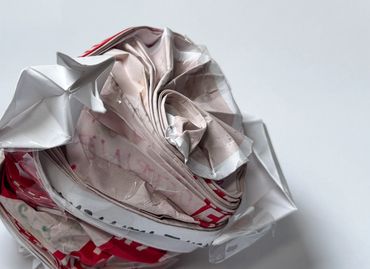Crushed and rolled plastic bags.