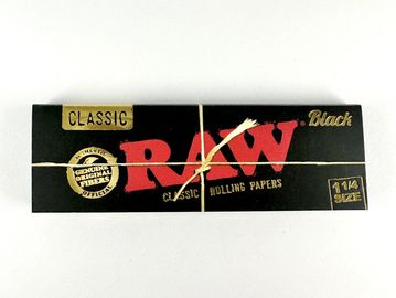 Box of RAW Classic Black rolling papers tied with string.