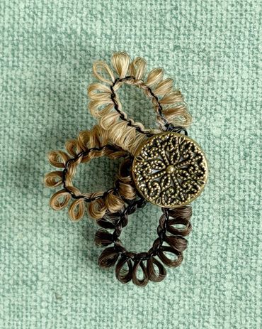 Magnet made with human hair and vintage button