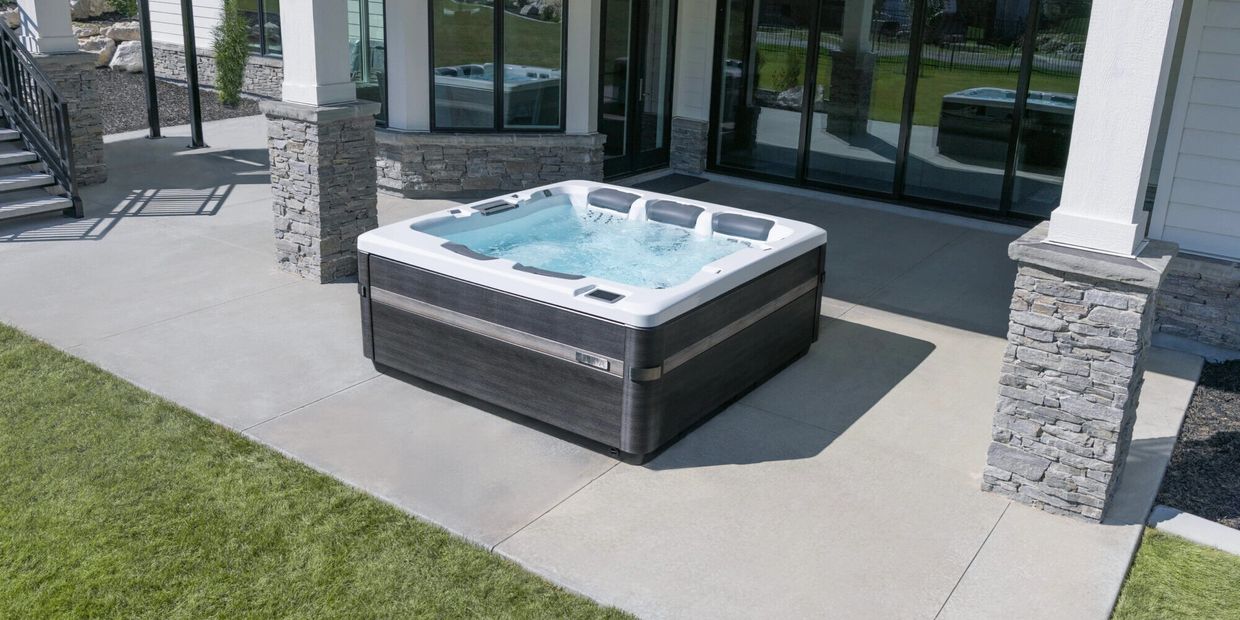 Bullfrog Spas A Series hot tub in a modern backyard