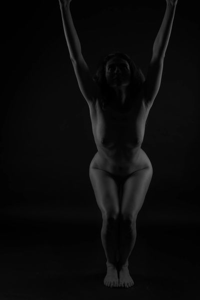 Art nude, perfect naked body, sexy young woman on dark background,