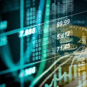 Golden bitcoins with digital financial data overlay.