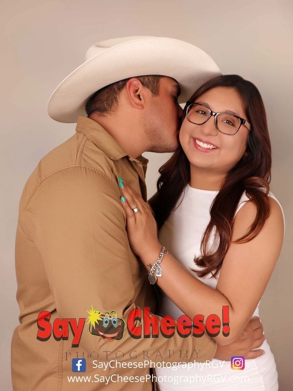 Couple sharing a tender moment during a photoshoot.