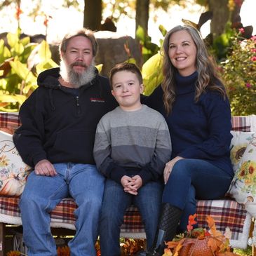 Photo of the Owner and her family. Her Husband is the technician. Family run business. Small busines