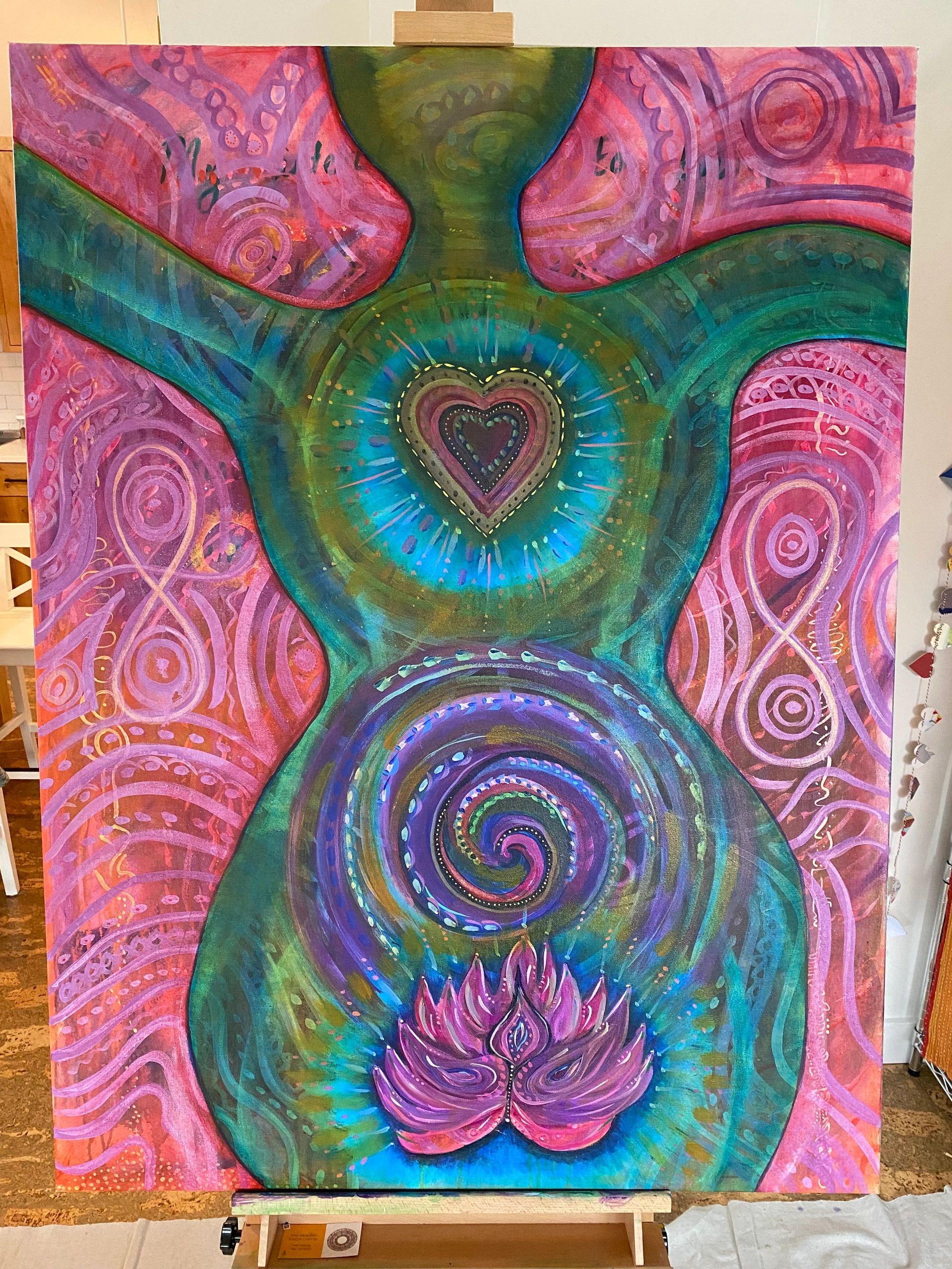 Colorful abstract painting of a human figure with a heart and spiral design.
