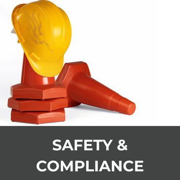 Yellow safety helmet and orange cones symbolize safety and compliance.