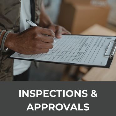 Person filling out an inspection form on a clipboard.