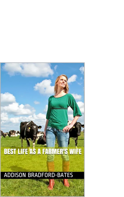 Woman standing confidently in a green shirt among cows on a farm.