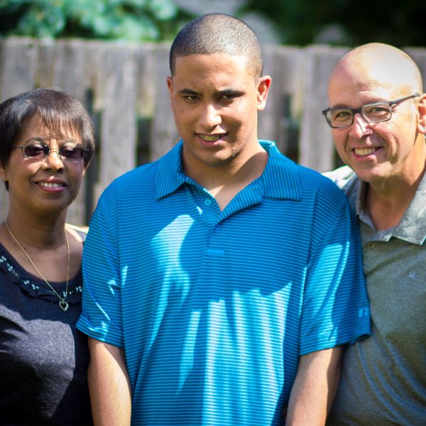 a young boy with his parents 