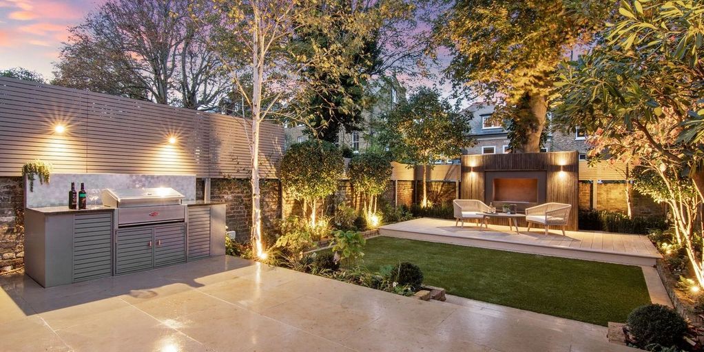 Patio Paving With An Outdoor Kitchen And Millboard Decking. Landscaping In Canford Cliffs, Poole