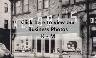 Black-and-white photo of a vintage gift shop storefront with display windows.