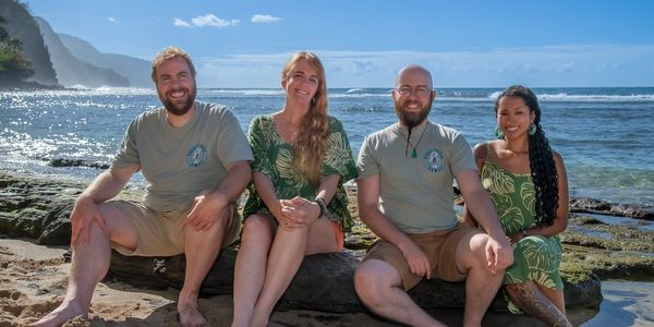 Kauai Kahuna Vacation Rentals staff at Ke'e Beach, 15 minutes past Hanalei Colony Resort.