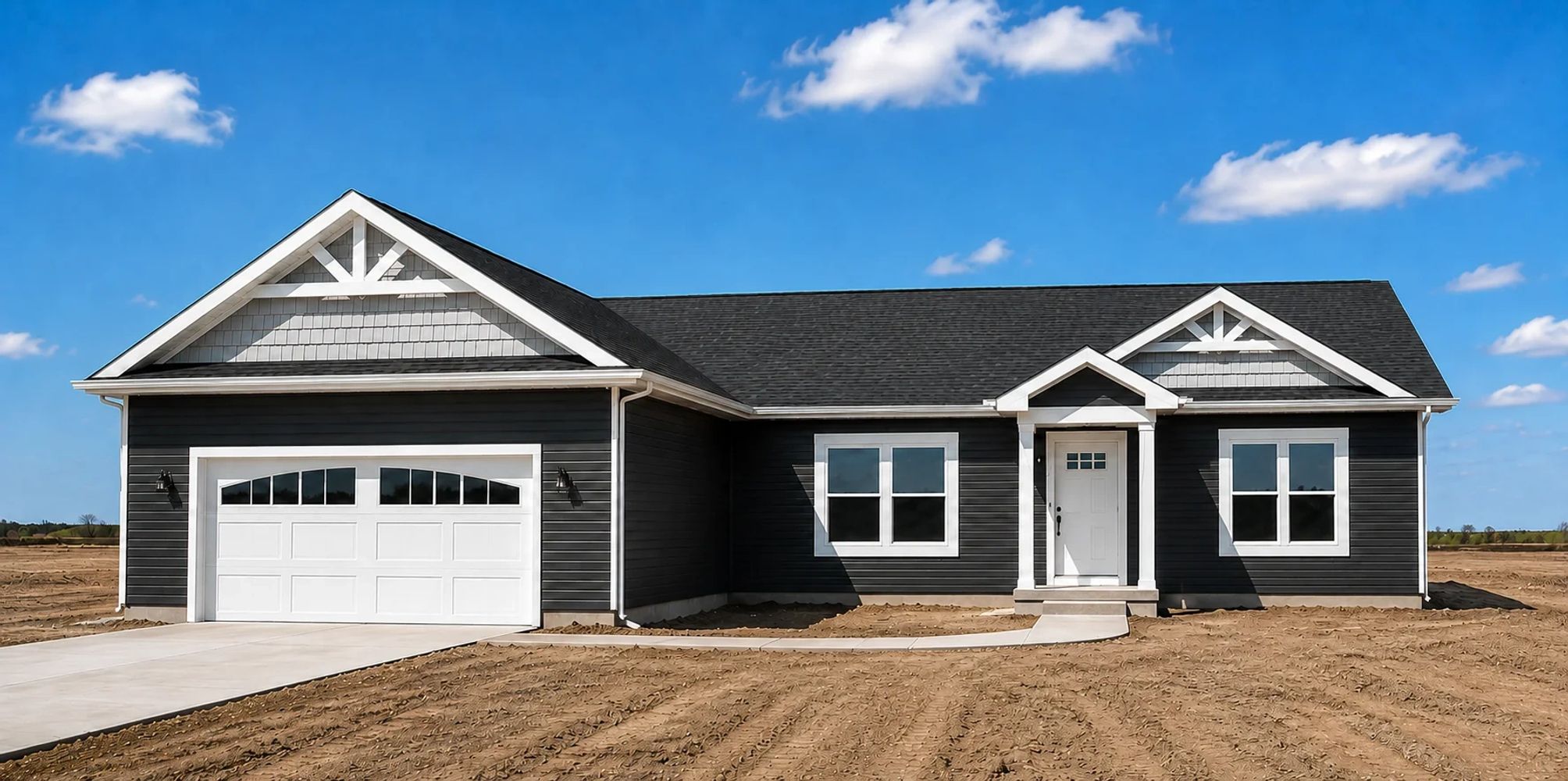 Modern white ranch home with black trim, black roof, spacious yard, and elegant front porch