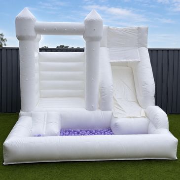 White castle with a ball pit and slide, perfect for tight spaces
