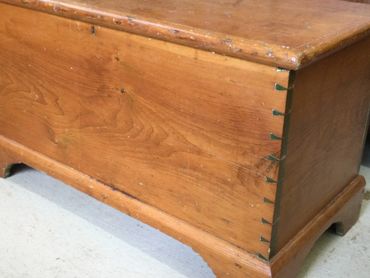 Close-up of a wooden chest with dovetail joints.