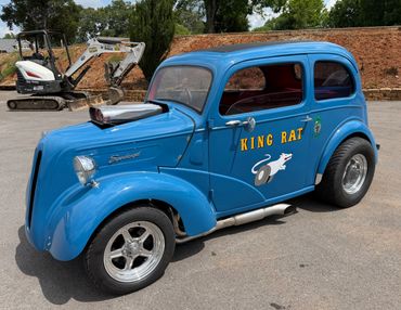 Blue vintage hot rod car named King Rat with custom modifications.