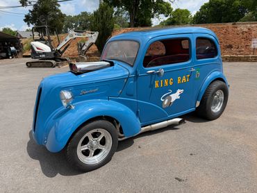 Bright blue vintage hot rod car named 'King Rat'.