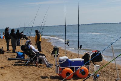 FIshermen and fishing gear at Sandy Point State Park in March