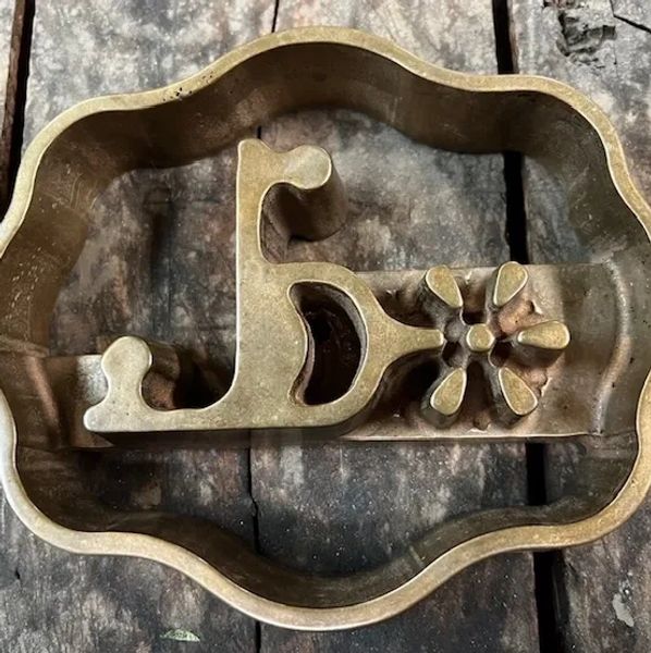 Our Oregon Registered Freeze Brand Iron.  Trophy Buckle with a Broken Spur in shape of letter L.