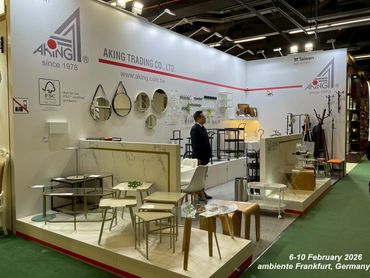 A modern exhibition booth showcasing furniture and home decor by Aking Trading Co., Ltd.