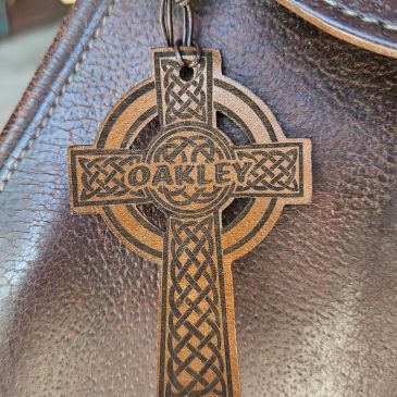 Wooden Oakley cross keychain with Celtic design.