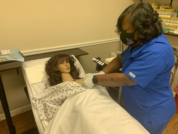 medical assistant of Essential Medical and Mental Health Institute practicing EKG