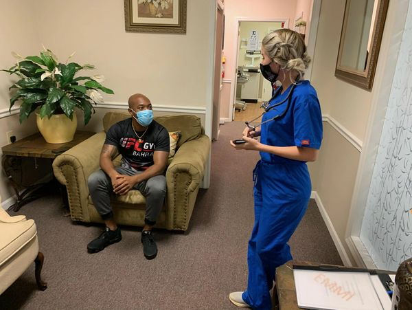 medical assistant of Essential Medical and Mental Health Institute working with a patient