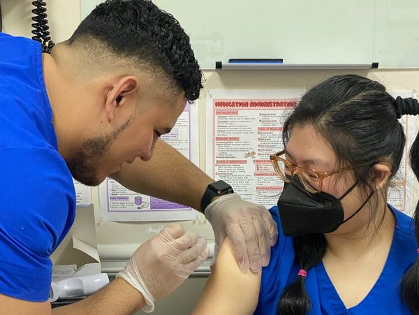 medical assistant of Essential Medical and Mental Health Institute practicing injections