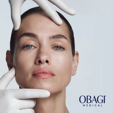 Close up of a woman's face being examined by a dermatologist with white gloves.
