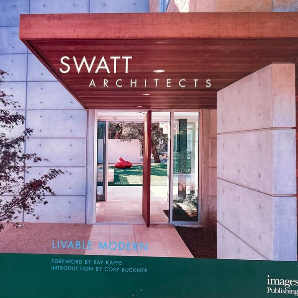 Modern architectural entrance with concrete and wood elements at Swatt Architects.
