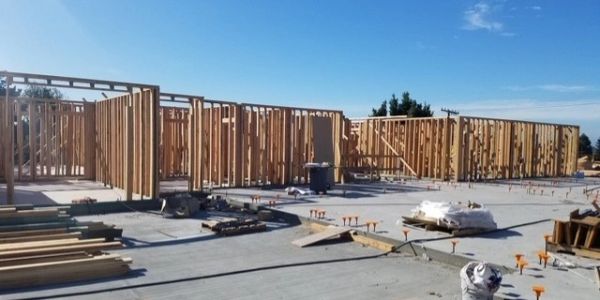 Construction site with wooden frames and foundation.