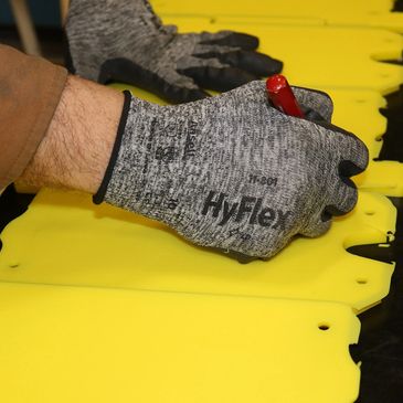 hand trimming UHMW plastic part