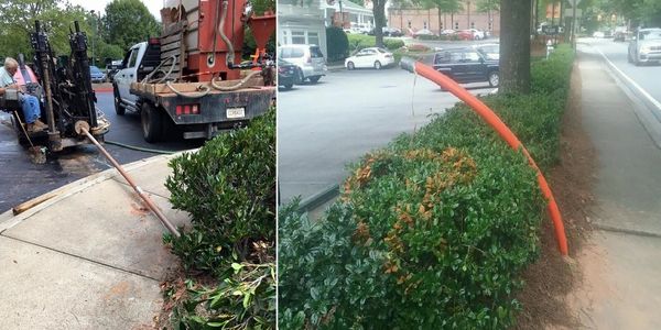 Directional boring under sidewalk and landscaping to avoid having to dig them up.