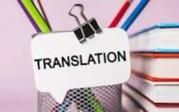 Paper with 'TRANSLATION' clipped to a pencil holder with colored pencils in the background.