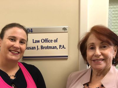 Kara and Susan in front of our office door in Boca Raton, FL.