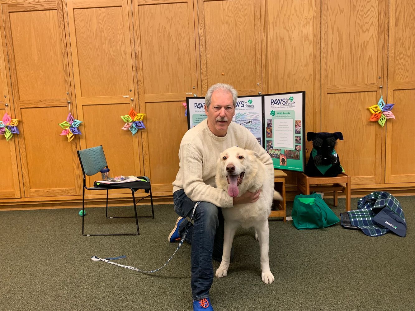 a man holding his dog