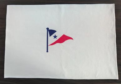 White fabric with a nautical flag design in blue and red.