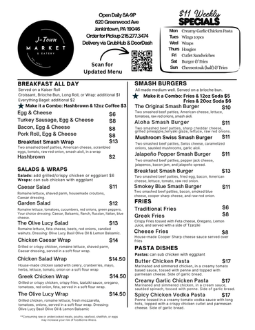 Menu board for J-Town Market detailing breakfast, salads, wraps, smash burgers, fries, and pasta dishes.