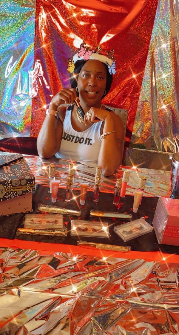 A woman selling lipstick cosmetics