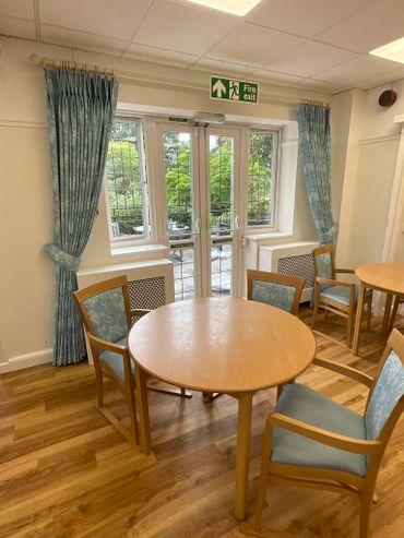 The New curtains on the same window in the care home, with matching self piped tie backs. New pole