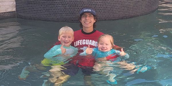 Ethan Chapa with Two Happy New Swimmers
