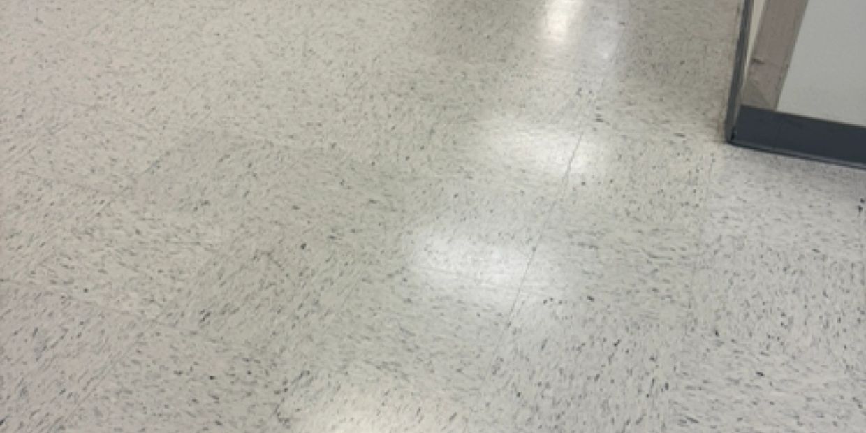 Tan and speckled commercial tile flooring.