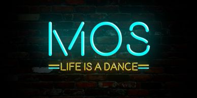 Neon lights reading "Mos: Life is a dance" 