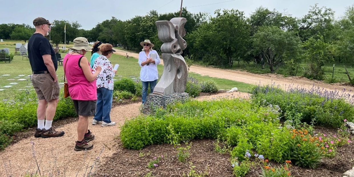 Picture of Master Gardener Linda Reed leading a guided Nature Walk through the Butterfly Garden 