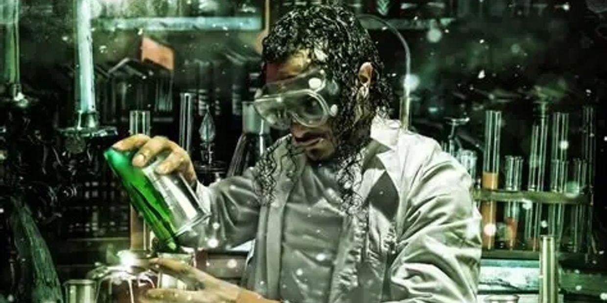 Scientist working with chemicals in a lab with safety goggles.