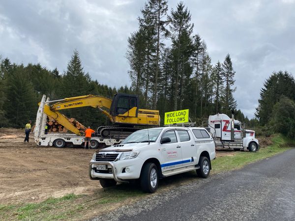 pilot ute in front of richmonds truck & trailer in the forrest ready to unload at site drop off